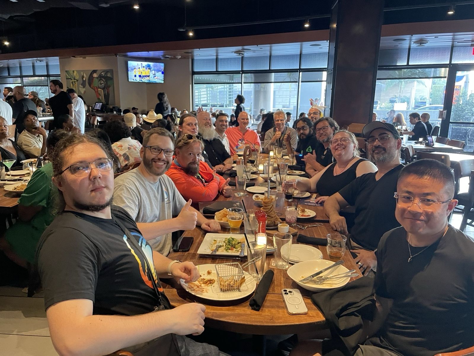 Attendees over drinks and snacks after AlmaLinux Day: LA